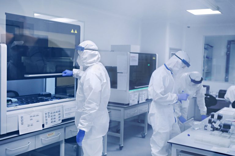 Group Of Technicians Working In Laboratory
